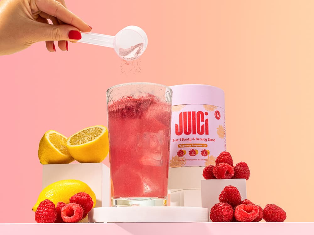 Juici raspberry lemonade bottle in styled scene - drinks lifestyle photography UK